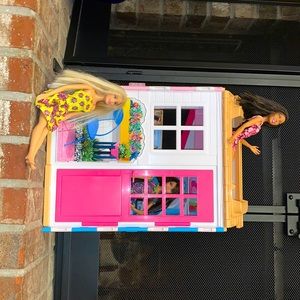 Barbie house and comes with three Barbies